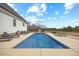 Backyard with a private pool featuring concrete pool deck, perfect for cooling off during those hot summer days at 3805 Barberry Lake Ct, Fuquay Varina, NC 27526