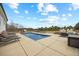 Gorgeous backyard oasis with a private pool, lounge chairs, fire pit, and patio furniture perfect for outdoor entertaining at 3805 Barberry Lake Ct, Fuquay Varina, NC 27526