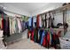 Well-organized walk-in closet featuring double hanging racks and neutral carpet at 3805 Barberry Lake Ct, Fuquay Varina, NC 27526