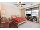A serene bedroom with two windows, a ceiling fan and neutral carpeting at 3836 Gloucester Rd, Rocky Mount, NC 27803