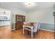 Traditional dining room with hardwood floors, a china cabinet, and natural light at 3836 Gloucester Rd, Rocky Mount, NC 27803