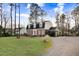 Well-maintained lawn and brick exterior of a home with three dormer windows at 3836 Gloucester Rd, Rocky Mount, NC 27803