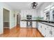 Bright kitchen features stainless steel appliances, white cabinets, and a window over the sink at 3836 Gloucester Rd, Rocky Mount, NC 27803