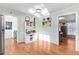A bright kitchen transitions to a sunny breakfast area with white cabinetry at 3836 Gloucester Rd, Rocky Mount, NC 27803