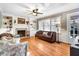Cozy living room with a fireplace, built-in bookshelves, and hardwood floors at 3836 Gloucester Rd, Rocky Mount, NC 27803