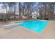 Large in-ground pool with diving board and spacious surrounding patio at 3836 Gloucester Rd, Rocky Mount, NC 27803