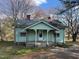 Charming single-story home with a covered front porch and light blue siding at 4 Second St, Franklinton, NC 27525