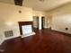 Living room featuring wood floors, a fireplace and multiple entryways at 4 Second St, Franklinton, NC 27525