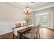 Bright dining room features modern lighting, wainscoting, and hardwood floors, perfect for entertaining at 4210 Massey Preserve Trl, Raleigh, NC 27616