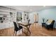 Office features built-in shelving, blue walls, natural light, and an open doorway at 422 Westwood Dr, Chapel Hill, NC 27516