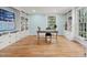 Bright and airy office space with built-in bookshelves and a large window at 422 Westwood Dr, Chapel Hill, NC 27516