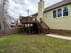 Backyard with lawn has a raised deck with access to the home's second level at 426 Fincastle Dr, Cary, NC 27513