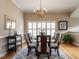 Dining room features hardwood floors, chandelier, rug, and large window at 426 Fincastle Dr, Cary, NC 27513