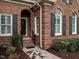 Close up of brick entryway featuring archway and black door at 426 Fincastle Dr, Cary, NC 27513