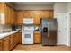 Well-equipped kitchen with stainless steel refrigerator and ample cabinet space at 426 Fincastle Dr, Cary, NC 27513