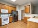 Bright kitchen with stainless steel appliances and wood cabinets at 426 Fincastle Dr, Cary, NC 27513