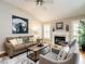 Inviting living room with fireplace, hardwood floors, and comfortable seating arrangement at 426 Fincastle Dr, Cary, NC 27513