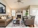 Comfortable living room with vaulted ceiling, fireplace, plush seating, and stylish decor at 426 Fincastle Dr, Cary, NC 27513