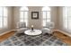 Cozy living room with chairs, rug, windows, and hardwood flooring at 426 Fincastle Dr, Cary, NC 27513