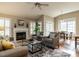 Bright living room featuring a fireplace, neutral walls, and comfortable seating near the dining area at 426 Fincastle Dr, Cary, NC 27513