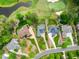 Breathtaking aerial shot showcasing exquisite homes bordering a golf course with mature trees and manicured lawns at 498 Mountain Laurel, Chapel Hill, NC 27517