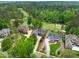 Aerial view showcasing the houses proximity to the golf course and surrounding wooded area at 498 Mountain Laurel, Chapel Hill, NC 27517