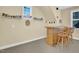 Bar with stools, shelving, and drinkware at 498 Mountain Laurel, Chapel Hill, NC 27517