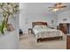 Bright bedroom with soft hues, complemented by a window and ceiling fan, offers a tranquil and inviting atmosphere at 498 Mountain Laurel, Chapel Hill, NC 27517