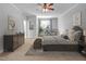 Spacious bedroom with a ceiling fan, sitting area, and comfortable furnishings, creating a serene retreat at 498 Mountain Laurel, Chapel Hill, NC 27517