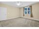 Spacious bedroom featuring plush carpet, a ceiling fan and window with bright natural light at 498 Mountain Laurel, Chapel Hill, NC 27517