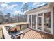 Spacious deck with a grill overlooking a golf course and screened in porch at 498 Mountain Laurel, Chapel Hill, NC 27517
