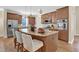 Gourmet kitchen featuring stainless steel appliances, granite countertops, and a stylish island with seating at 498 Mountain Laurel, Chapel Hill, NC 27517
