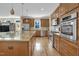 Spacious kitchen with stainless steel appliances, granite counters, and wooden cabinets at 498 Mountain Laurel, Chapel Hill, NC 27517