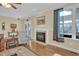 Bright living room with hardwood floors, fireplace, and sunroom access at 498 Mountain Laurel, Chapel Hill, NC 27517