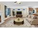 Cozy living room with neutral tones, stylish furnishings, a fireplace, and an inviting atmosphere at 498 Mountain Laurel, Chapel Hill, NC 27517