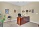 Inviting home office with a large wooden desk and ample natural light for a productive workspace at 498 Mountain Laurel, Chapel Hill, NC 27517