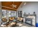 Relaxing sunroom with stone fireplace, wood ceiling, tile floor and plenty of natural light at 498 Mountain Laurel, Chapel Hill, NC 27517