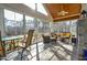 Sunroom featuring a vaulted wood ceiling, ample seating and a table for dining at 498 Mountain Laurel, Chapel Hill, NC 27517
