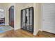 The wine cellar in this home features glass-front wine coolers and hardwood floors at 498 Mountain Laurel, Chapel Hill, NC 27517