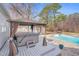 Backyard featuring a hot tub, gazebo, pool, and patio, perfect for relaxation and entertainment at 520 Log Barn Rd, Pittsboro, NC 27312