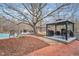 Spacious backyard with brick patio, outdoor kitchen, and gazebo-covered grilling station at 520 Log Barn Rd, Pittsboro, NC 27312