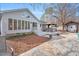 Landscaped backyard with a patio, hot tub, and lush plantings offering a serene outdoor retreat at 520 Log Barn Rd, Pittsboro, NC 27312