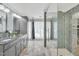 Beautiful bathroom showcasing a glass walk-in shower and double sink vanity with granite countertops at 520 Log Barn Rd, Pittsboro, NC 27312