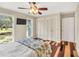 Bedroom with hardwood floors, three closets, and ample natural light at 520 Log Barn Rd, Pittsboro, NC 27312