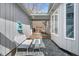 Secluded courtyard with stone patio, comfortable seating, and a relaxing fountain at 520 Log Barn Rd, Pittsboro, NC 27312