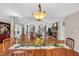 Spacious dining room in open floor plan; view of living room with vaulted ceiling and fireplace at 520 Log Barn Rd, Pittsboro, NC 27312
