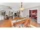 Open concept with dining room view into living area and kitchen with updated appliances at 520 Log Barn Rd, Pittsboro, NC 27312