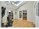 Home gym with skylights, exercise equipment, and hardwood flooring at 520 Log Barn Rd, Pittsboro, NC 27312