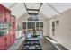 Bright kitchen features custom cabinets, granite countertops, and a large island cooktop with backyard views at 520 Log Barn Rd, Pittsboro, NC 27312