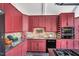 Kitchen with custom cabinets, granite countertops, backsplash, stainless steel appliances, and a convenient layout at 520 Log Barn Rd, Pittsboro, NC 27312